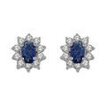 Boucles d'oreille sur Artemare : Boucles d'oreilles en argent rhodi&eacute; collection joaillerie oxyde bleu au centre et petits oxydes blancs autour et fermoir poussette