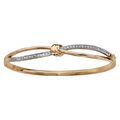 Bracelets sur Artemare : Bracelet jonc en plaqu&eacute; or articul&eacute; noeud et oxydes blancs sertis