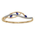 Bracelets sur Artemare : Bracelet jonc en plaqu&eacute; or articul&eacute; vague oxydes blancs sertis 3 navettes bleues