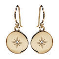 Boucles d'oreille sur Artemare : Boucles d'oreille pendantes en plaqu&eacute; or pastille et &eacute;toile au centre orn&eacute;e d' 1 oxyde blanc serti et fermoir crochet
