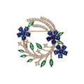 Broches sur Artemare : Broche en plaqu&eacute; or motif feuillage avec oxydes blancs bleus et verts