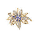 Broches sur Artemare : Broche en plaqu&eacute; or motif fleur avec oxydes bleus et blancs sertis