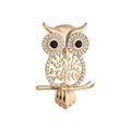 Broches sur Artemare : Broche en plaqu&eacute; or hibou ou chouette motif arbre de vie et oxydes sertis blancs et noirs