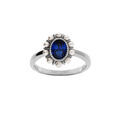 Bagues sur Artemare : Bague en argent rhodi&eacute; avec oxyde central bleu contour perle blanches imitation