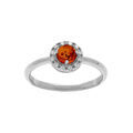 Bague en argent rhodi&eacute; avec ambre v&eacute;ritable ronde contour orn&eacute; d'oxydes blancs
