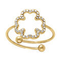 Alliances sur Artemare : Bague en acier dor&eacute; avec fleur &eacute;vid&eacute;e contour d'oxydes blancs sertis - r&eacute;glable