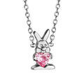 Colliers sur Artemare : Collier pour enfant en argent rhodi&eacute; cha&icirc;ne avec pendentif lapin tenant 1 oxyde rose - longueur 36cm + 2cm de rallonge