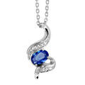 Colliers sur Artemare : Collier en argent rhodi&eacute; collection joaillerie cha&icirc;ne avec pendentif oxyde ovale bleu au centre de vagues orn&eacute;es d'oxydes blancs sertis - longueur 40cm + 4cm de rallonge