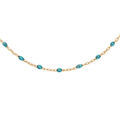 Colliers sur Artemare : Collier en argent et dorure jaune cha&icirc;ne avec olives couleur bleu transparent 40+5cm