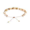Bracelet en acier et PVD dor&eacute; cordon coulissant rondelles coquillage nacr&eacute;