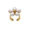 Bague ouverte en acier dor&eacute; motif fleur p&eacute;table blanc Artemare