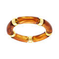 Bracelet extensible couleur ambre &agrave; anneaux dor&eacute;s