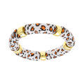Bracelets sur Artemare : Bracelet extensible l&eacute;opard &agrave; anneaux dor&eacute;s fond blanc et tachet&eacute; orange