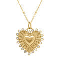 Collier en acier dor&eacute; avec pendentif coeur 22mm rayonnant avec contour d' oxydes blancs - 45+5cm